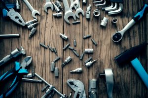 various tools on a wood background