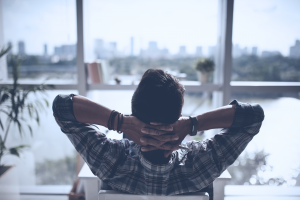 man looking out the window